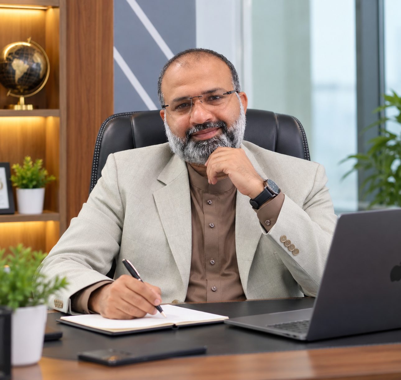 Qais Muhammad Yasir working at the office